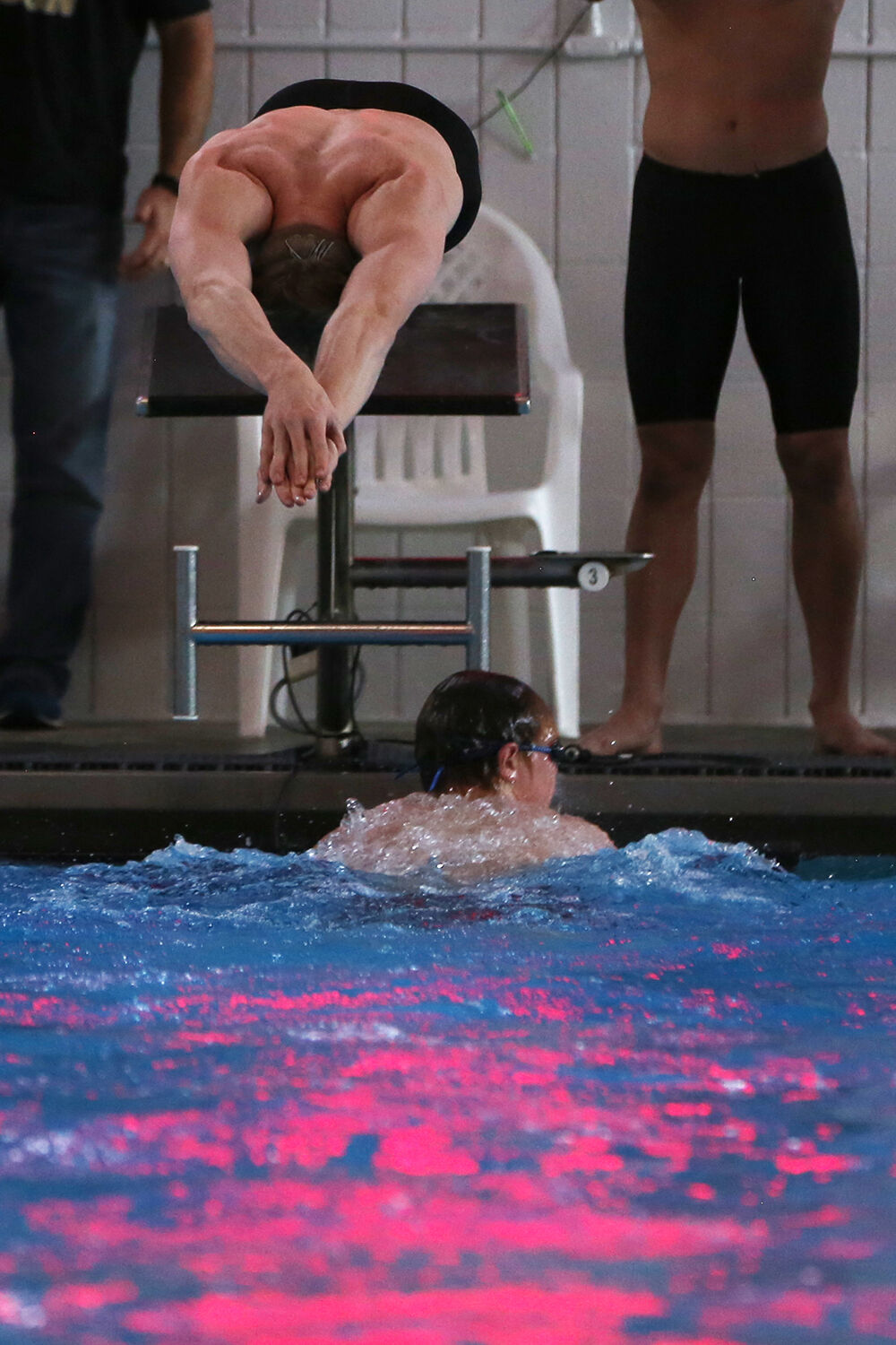 John Wonka dives into the pool to begin the butterfly